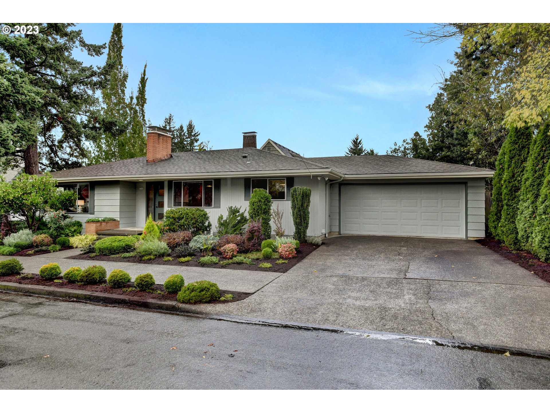 6309 Northeast Hancock Street Portland, OR 97213 - Photo 43 of 43 a front view of a house with garden