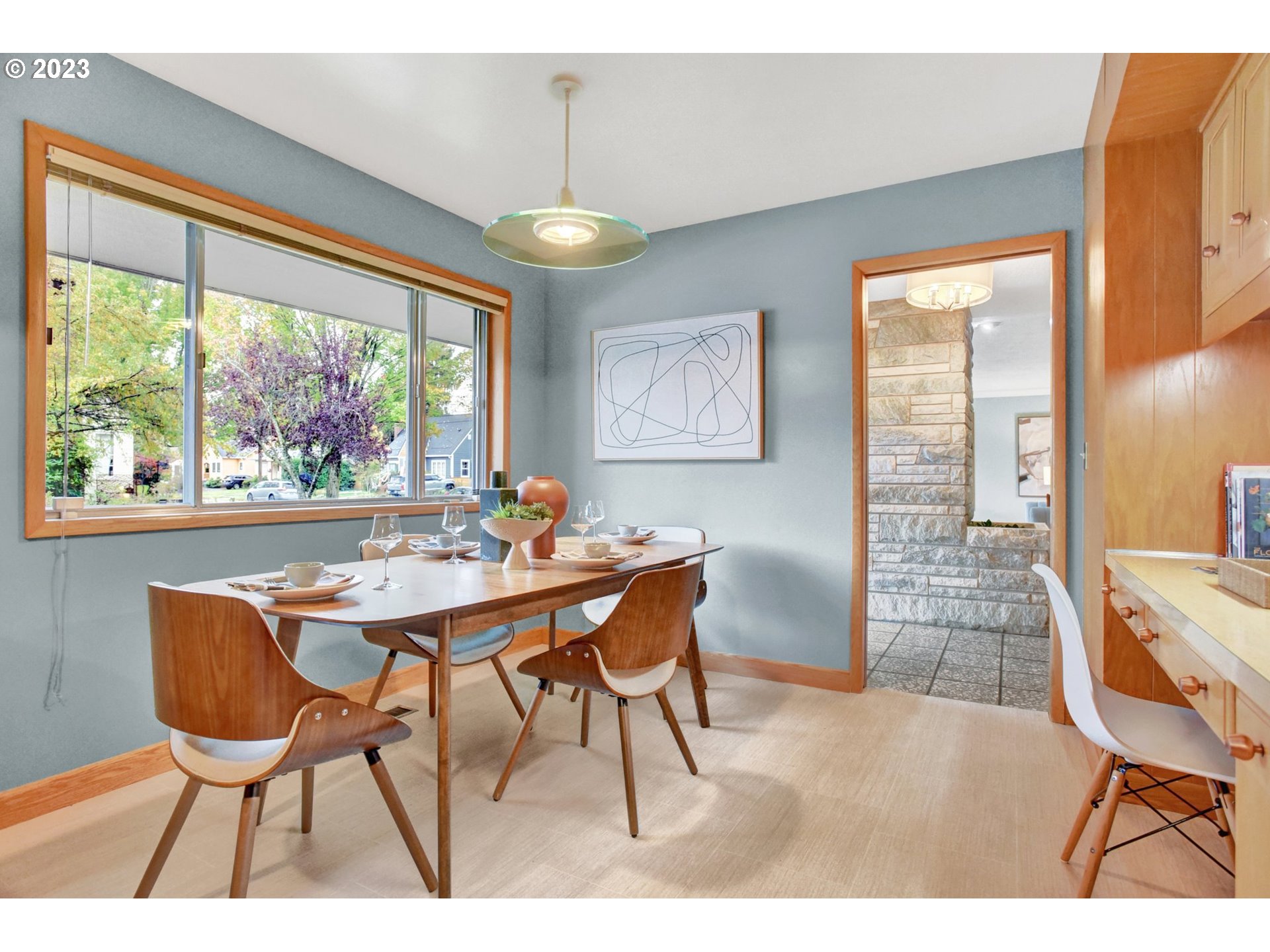 6309 Northeast Hancock Street Portland, OR 97213 - Photo 10 of 43 a dining room with furniture a chandelier and wooden floor