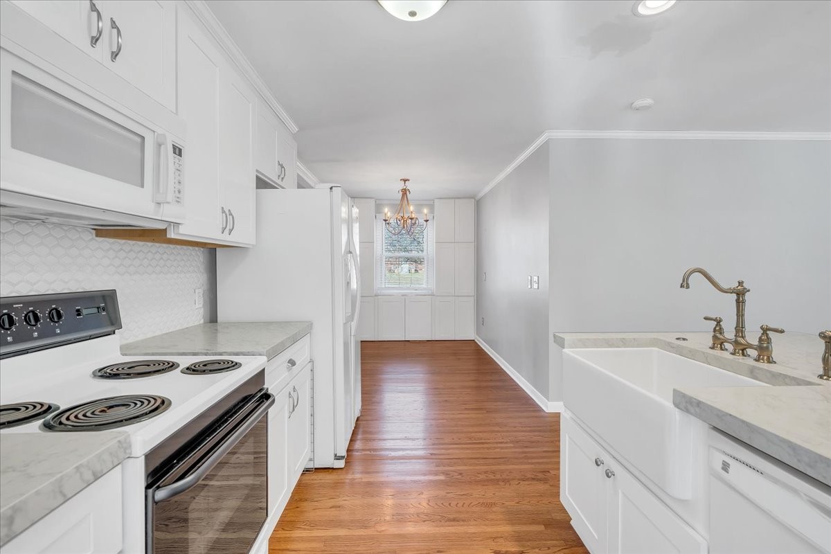361 Tusculum Road Nashville, TN 37211 - Photo 11 of 42 a kitchen with granite countertop a sink stove and cabinets