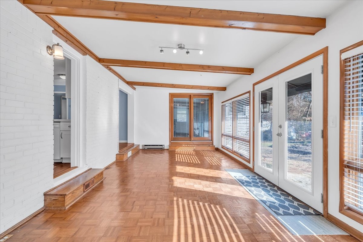 361 Tusculum Road Nashville, TN 37211 - Photo 7 of 42 a view of a hallway with wooden floor and windows