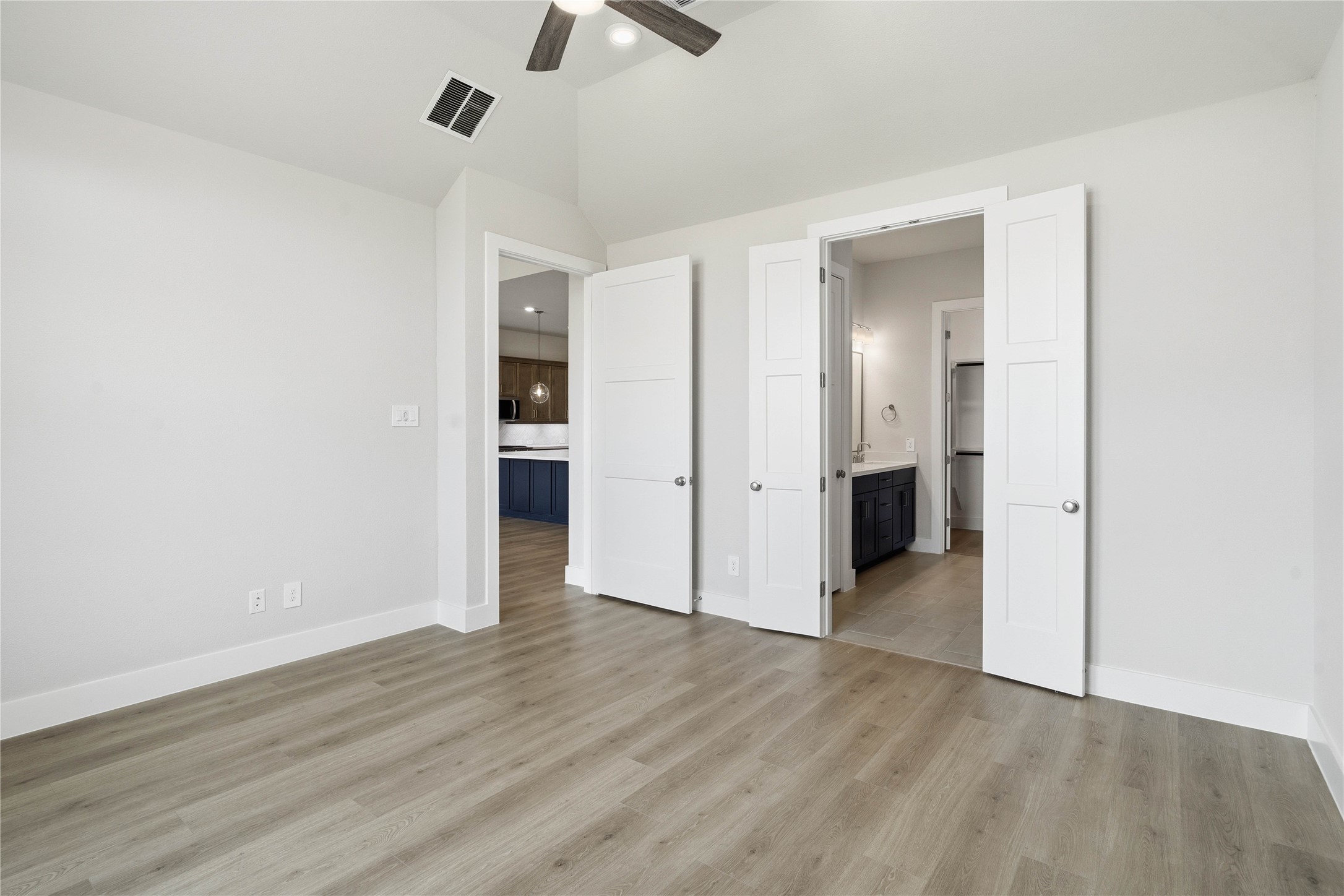 9123 Petroglyph Pt Court Porter, TX 77365 - Photo 29 of 43 wooden floor in an empty room with a bathroom