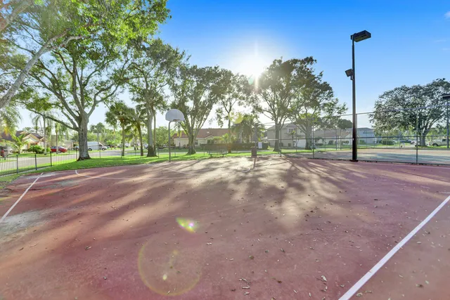 a view of a road with a house in the background