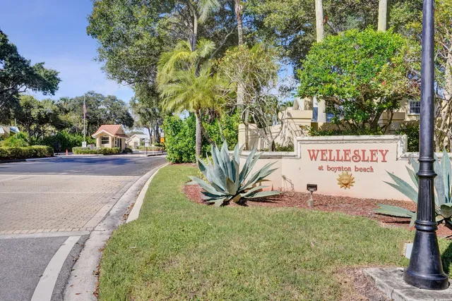 a view of a street with a sign board