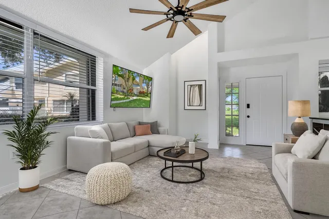 a living room with furniture and a large window