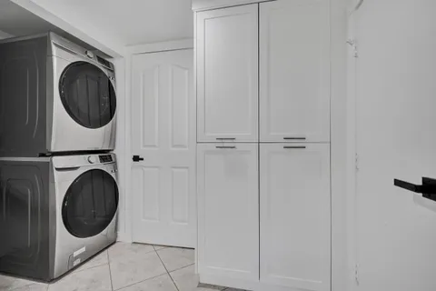 a view of a hallway with washer and dryer