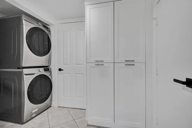 a view of a hallway with washer and dryer