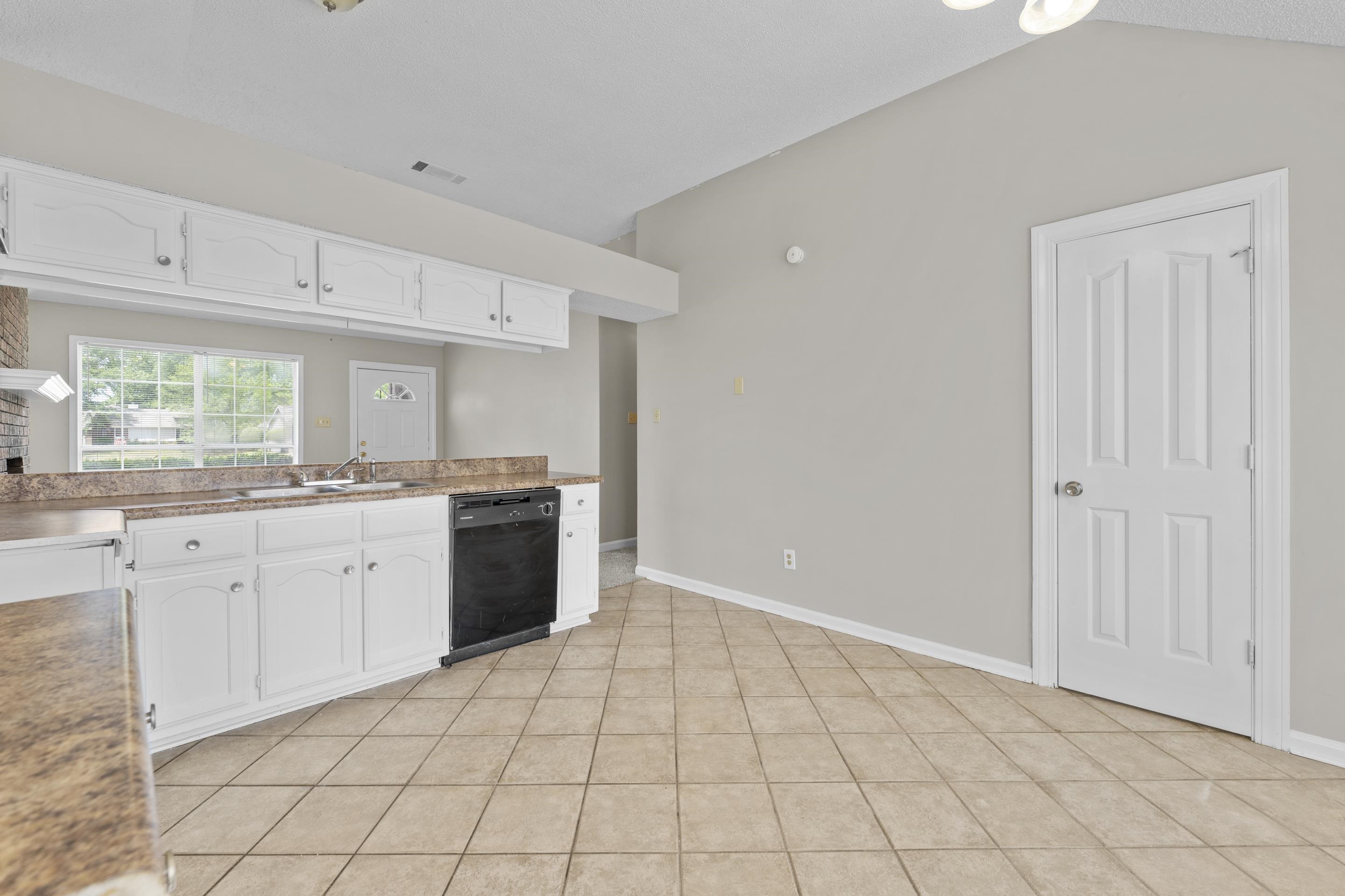 5339 Shady Ridge Cove Memphis, TN 38141 - Photo 11 of 31 The spacious kitchen provides ample cabinetry, expansive counter space, tile floors, and an easy flow into the living areas for convenient everyday living.