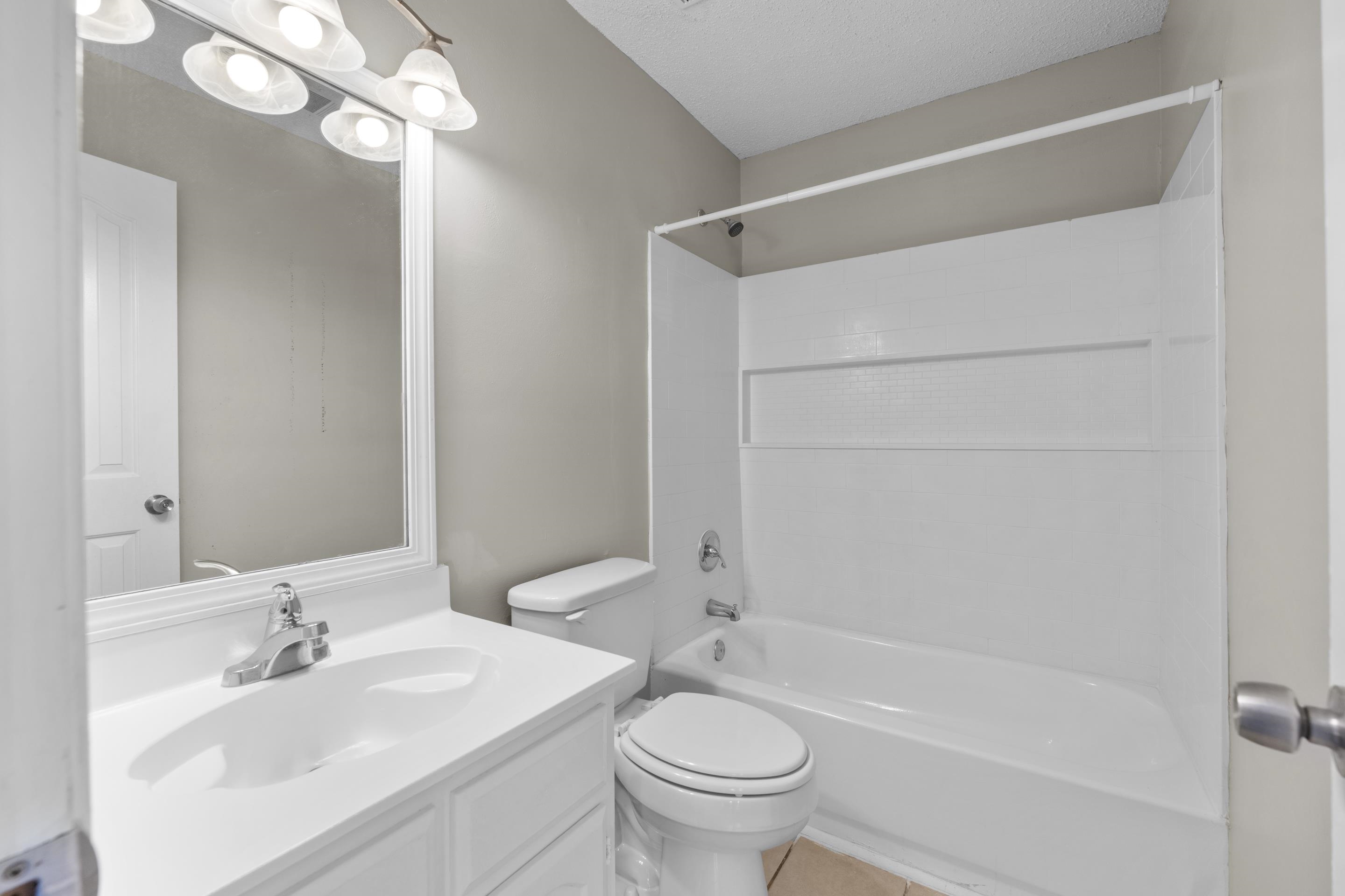 5339 Shady Ridge Cove Memphis, TN 38141 - Photo 17 of 31 The private primary bath features a spacious vanity with generous counter space, bright lighting, and a tub/shower combination designed for comfort and convenience.