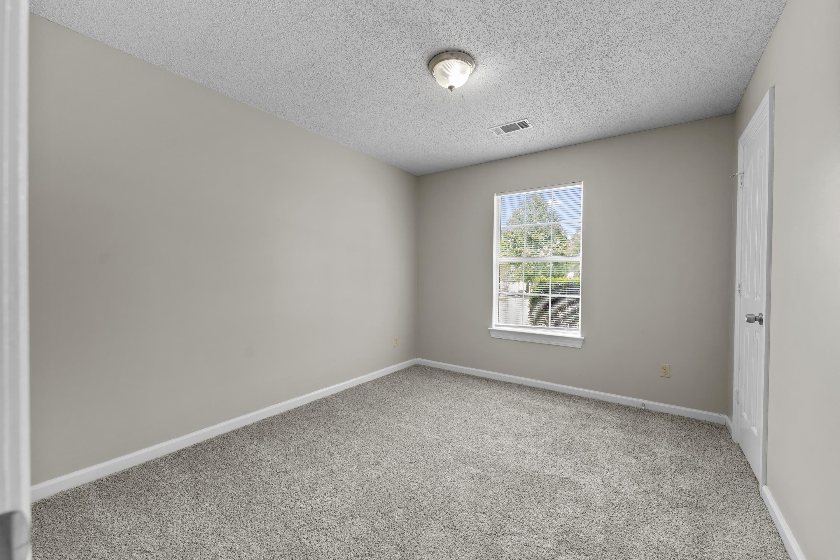 5339 Shady Ridge Cove Memphis, TN 38141 - Photo 19 of 31 Natural light fills this inviting bedroom featuring new carpet, neutral paint tones, and a versatile layout ready to fit your lifestyle needs.