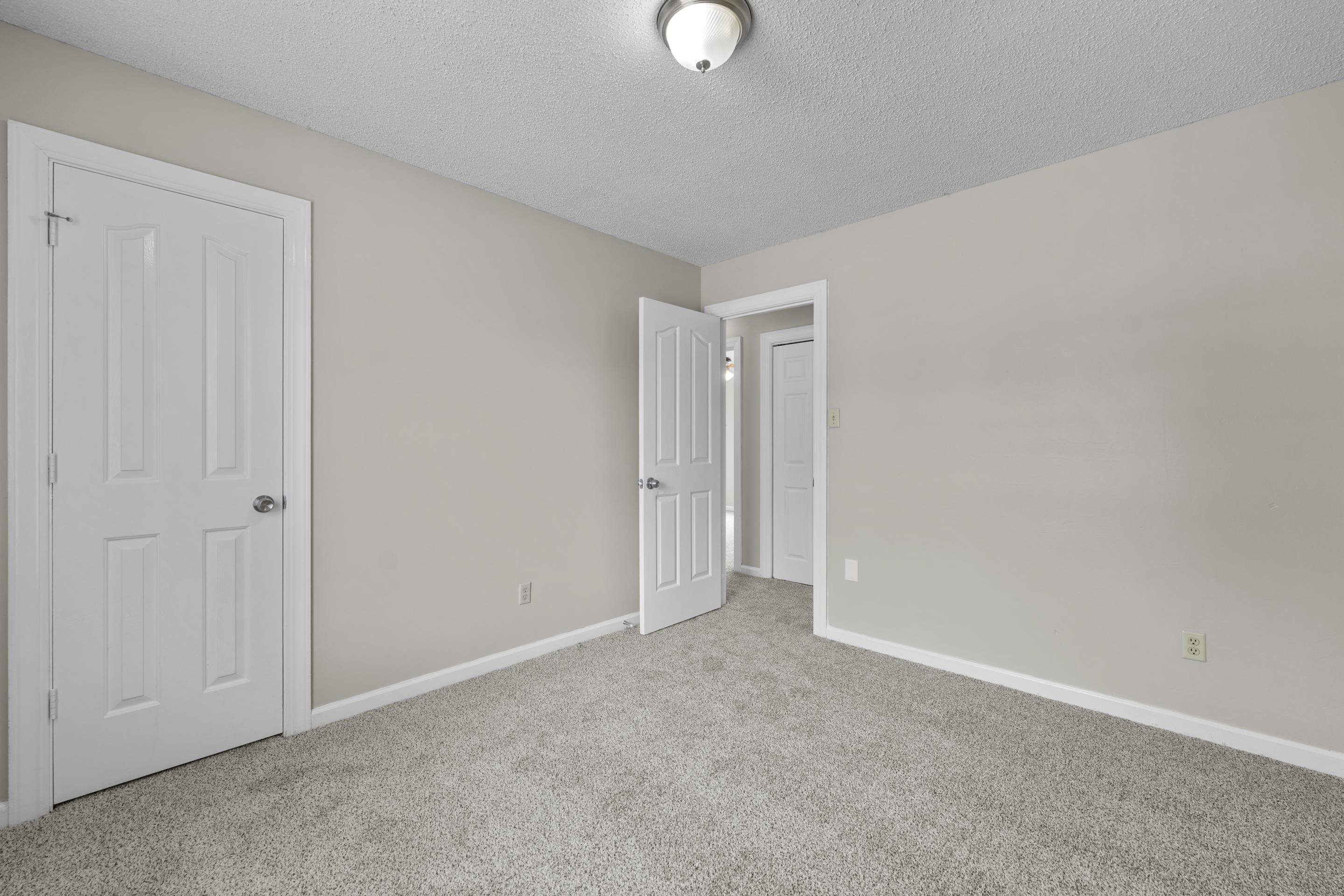 5339 Shady Ridge Cove Memphis, TN 38141 - Photo 20 of 31 This cozy staged bedroom showcases the comfortable size and welcoming feel of the space with soft neutral colors, plush carpet, and room for both relaxation and functionality.