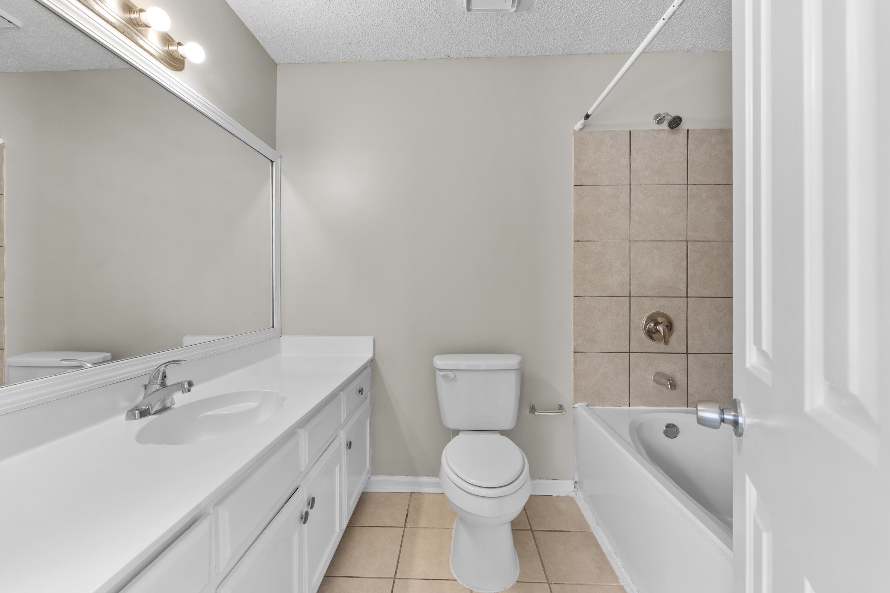 5339 Shady Ridge Cove Memphis, TN 38141 - Photo 21 of 31 The shared bathroom offers a clean and refreshed feel with bright finishes, updated vanity, modern lighting, and a tub/shower combination designed for everyday convenience.