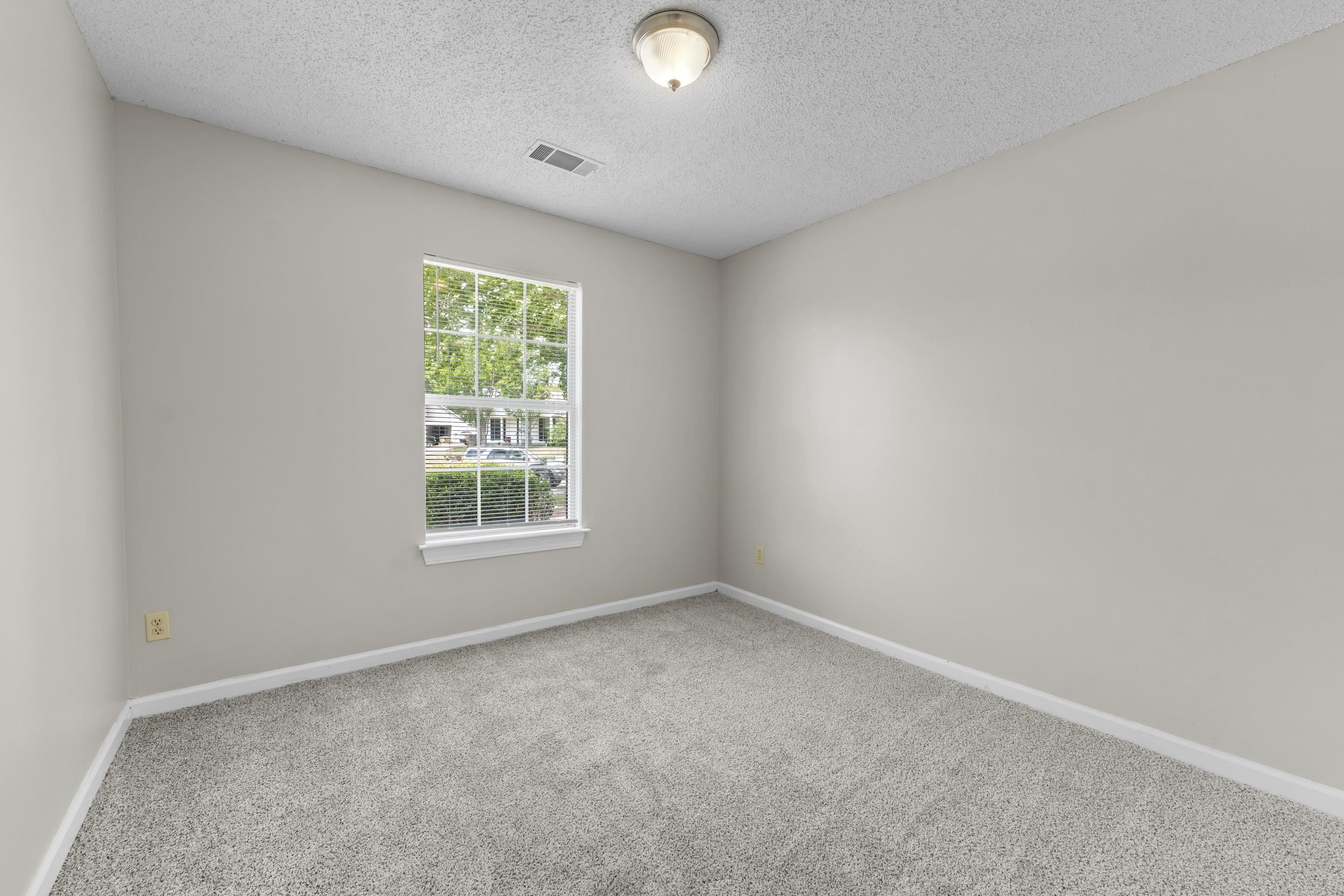 5339 Shady Ridge Cove Memphis, TN 38141 - Photo 23 of 31 This spacious bedroom offers a clean and move-in ready feel with soft carpet, neutral finishes, and convenient closet storage, making it ideal for a bedroom, nursery, or office space.
