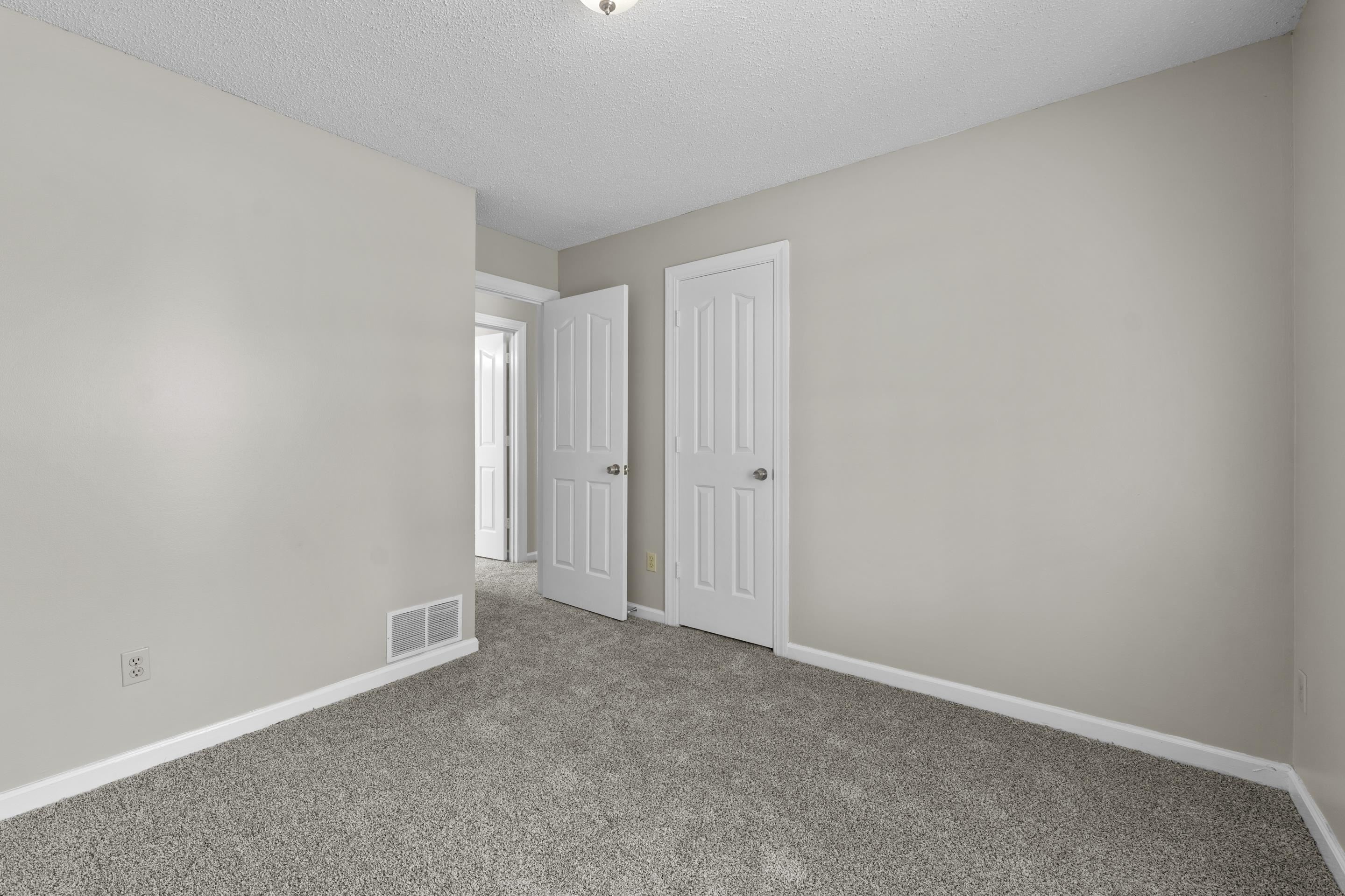 5339 Shady Ridge Cove Memphis, TN 38141 - Photo 24 of 31 This charming third bedroom offers a comfortable and inviting feel with soft neutral tones, plush carpet, and natural light that creates a relaxing space.