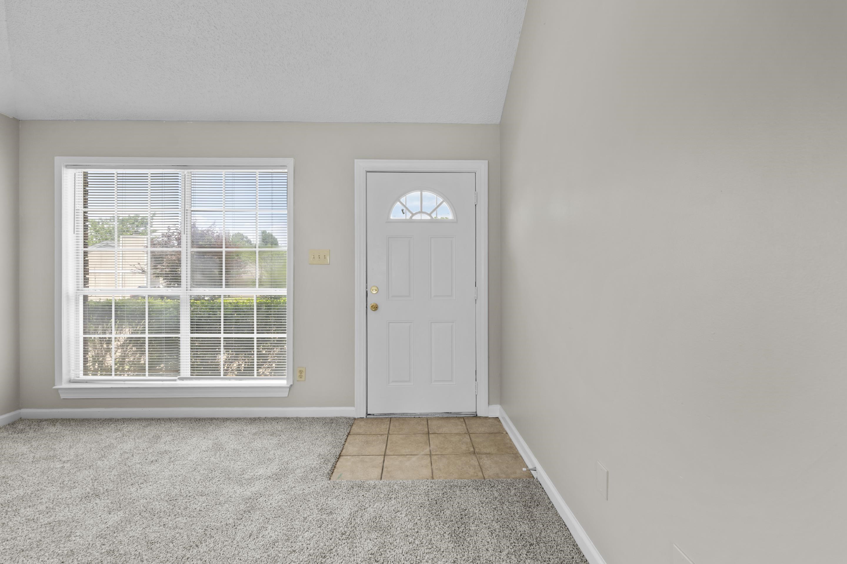 5339 Shady Ridge Cove Memphis, TN 38141 - Photo 3 of 31 Step inside and feel right at home. The inviting front entry welcomes guests directly into the spacious great room filled with natural light from the oversized window.