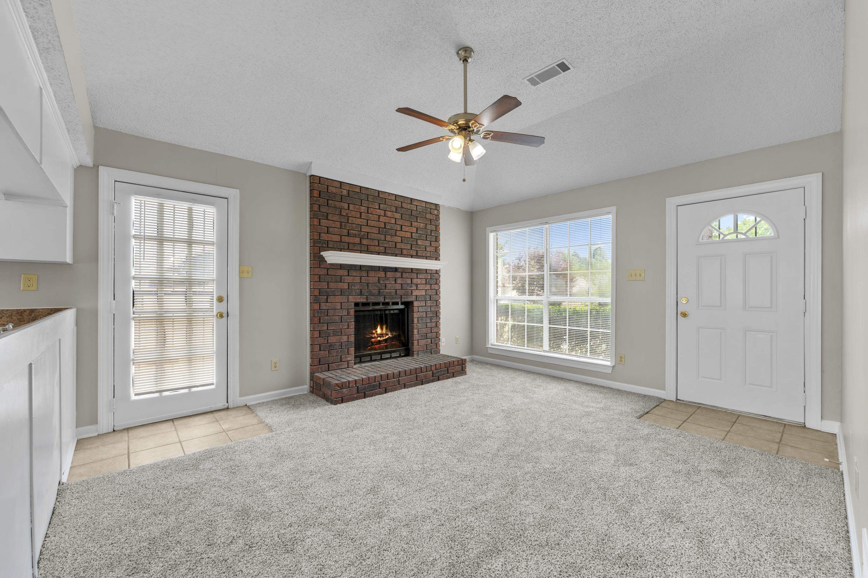 5339 Shady Ridge Cove Memphis, TN 38141 - Photo 7 of 31 Enjoy a spacious great room with vaulted ceilings, cozy fireplace, and easy access to the kitchen.