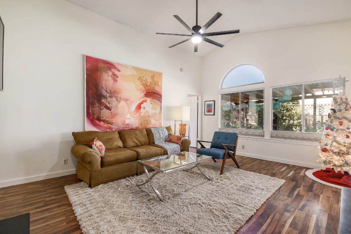16806 Langland Road Pflugerville, TX 78660 - Photo 14 of 31 a living room with furniture rug and window