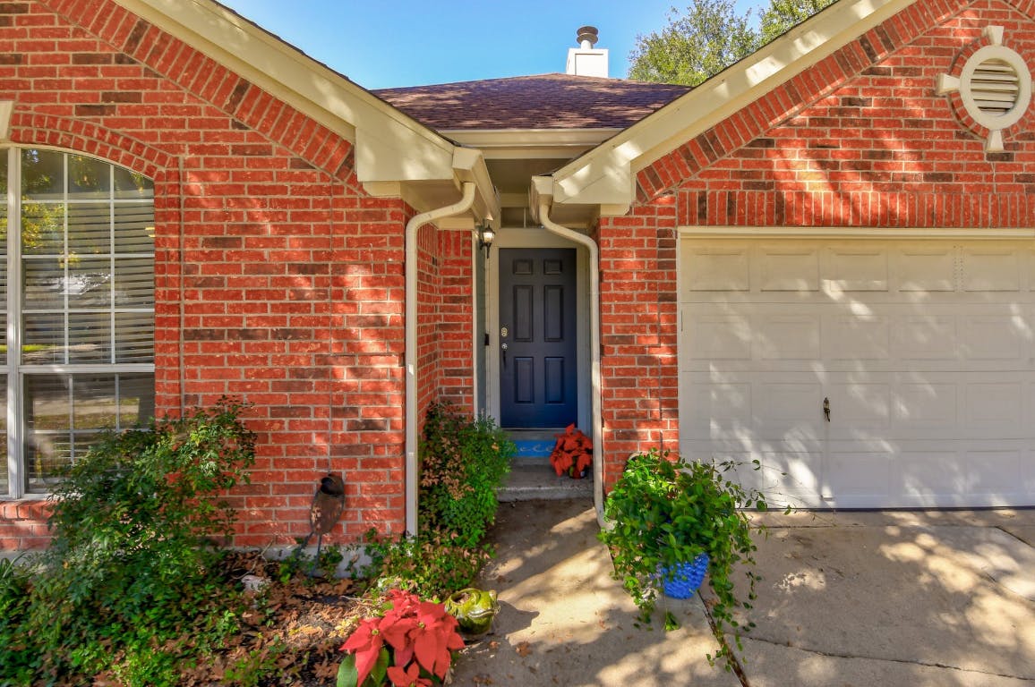 16806 Langland Road Pflugerville, TX 78660 - Photo 15 of 31 a front view of a house with plants
