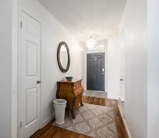 a bathroom with a toilet a sink and a mirror