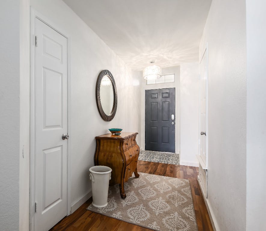 16806 Langland Road Pflugerville, TX 78660 - Photo 20 of 31 a bathroom with a toilet a sink and a mirror