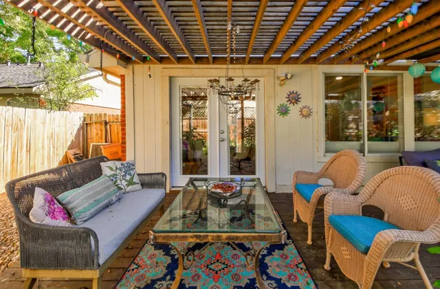 a bedroom with furniture and a large window