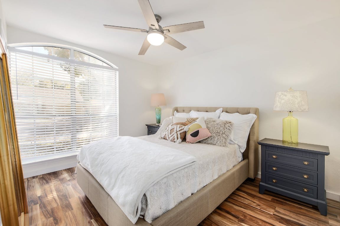 16806 Langland Road Pflugerville, TX 78660 - Photo 10 of 31 a bedroom with a bed and a window