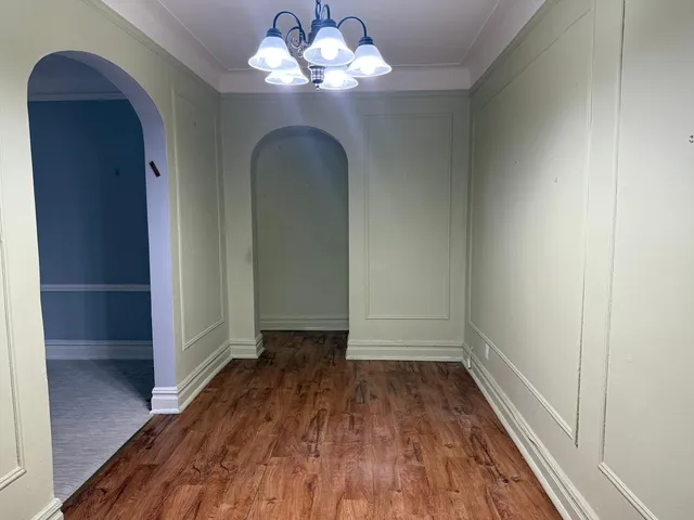 a view of a livingroom with wooden floor