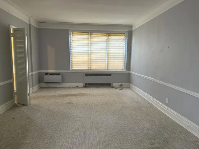 a spacious bathroom with a bathtub and a shower