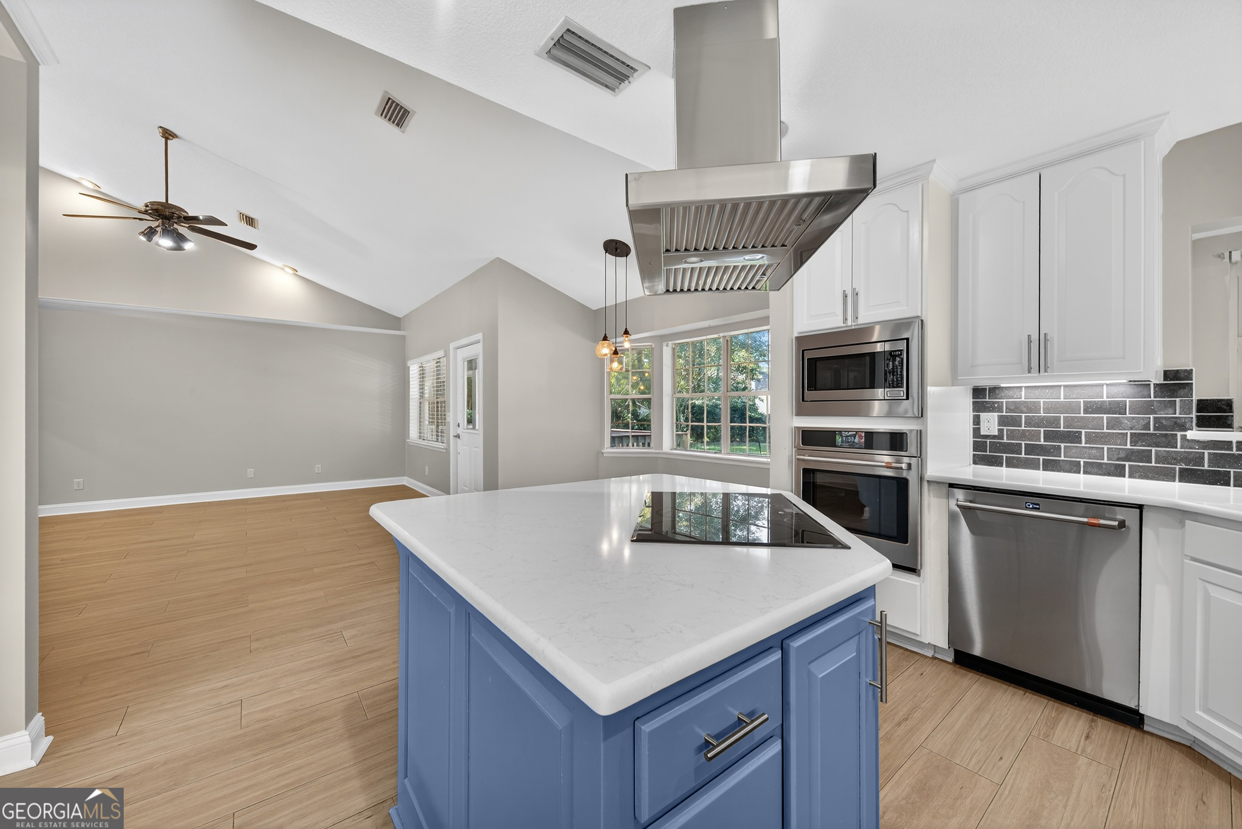 404 Morning Glory Road St. Marys, GA 31558 - Photo 11 of 34 a kitchen with a stove a sink and a refrigerator