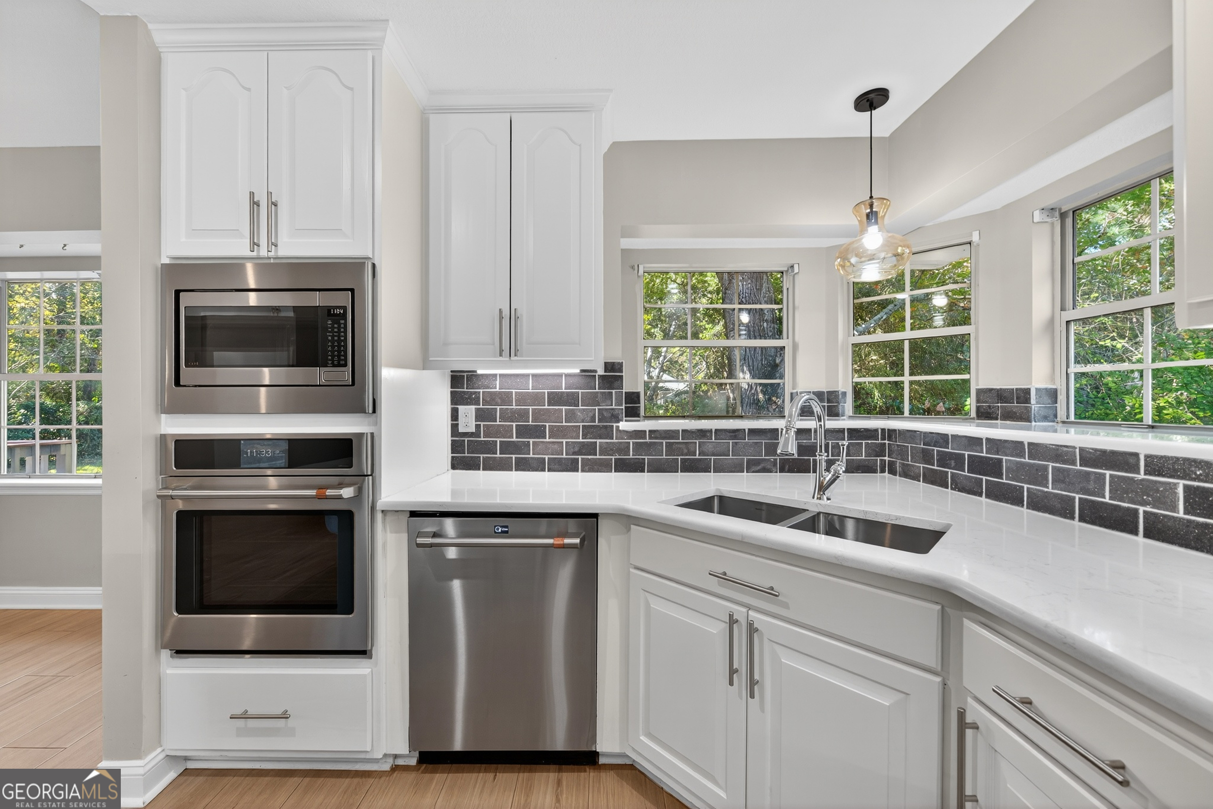 404 Morning Glory Road St. Marys, GA 31558 - Photo 12 of 34 a kitchen with a sink and stainless steel appliances