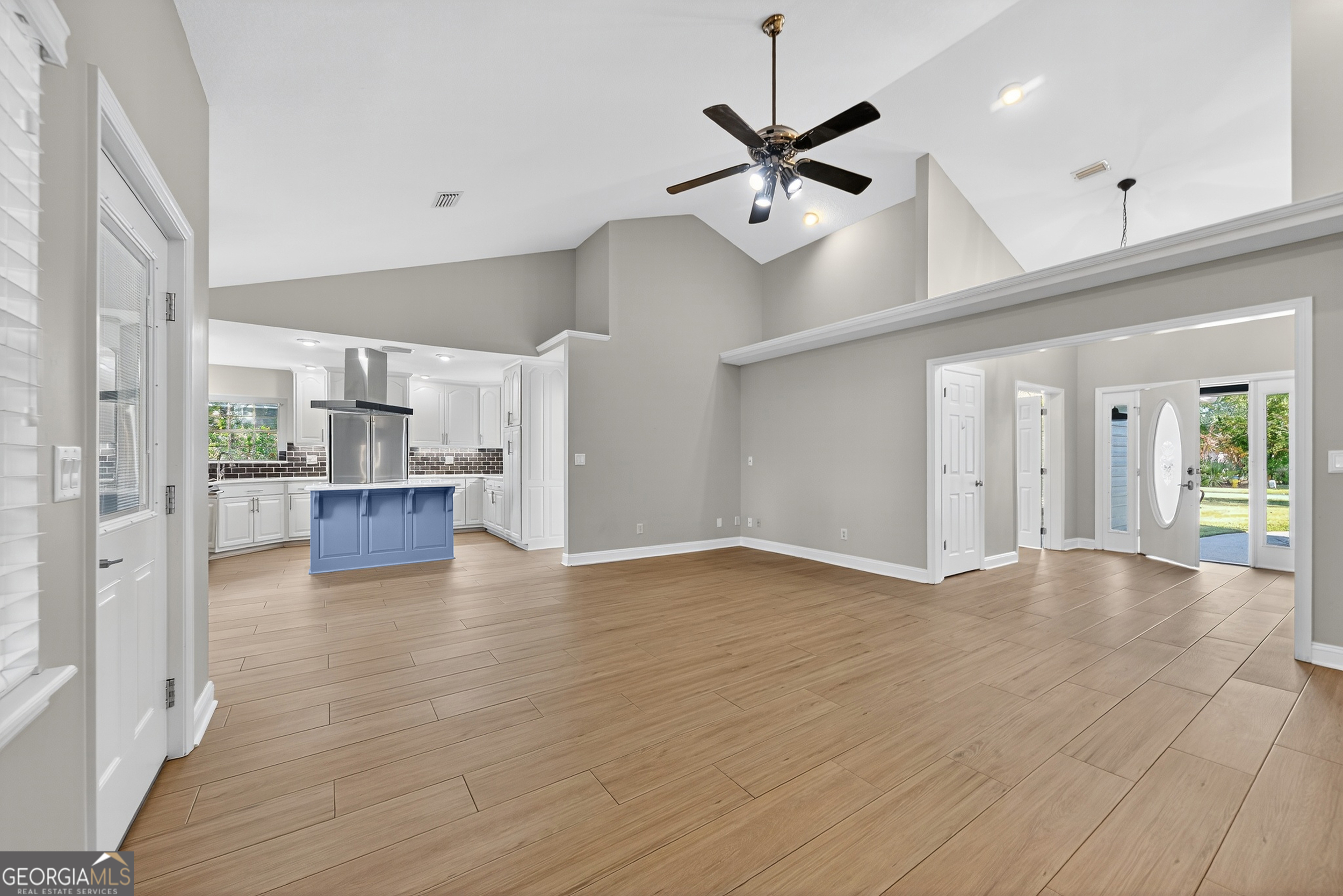 404 Morning Glory Road St. Marys, GA 31558 - Photo 16 of 34 a view of an empty room and kitchen with wooden floor