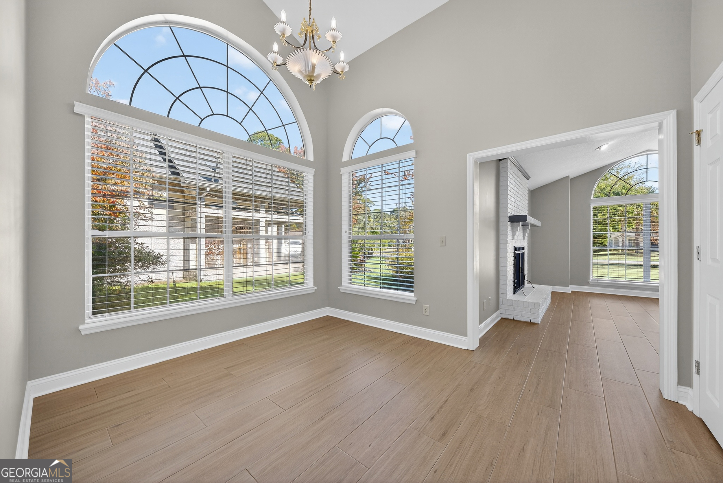 404 Morning Glory Road St. Marys, GA 31558 - Photo 18 of 34 a view of an empty room with wooden floor and a window