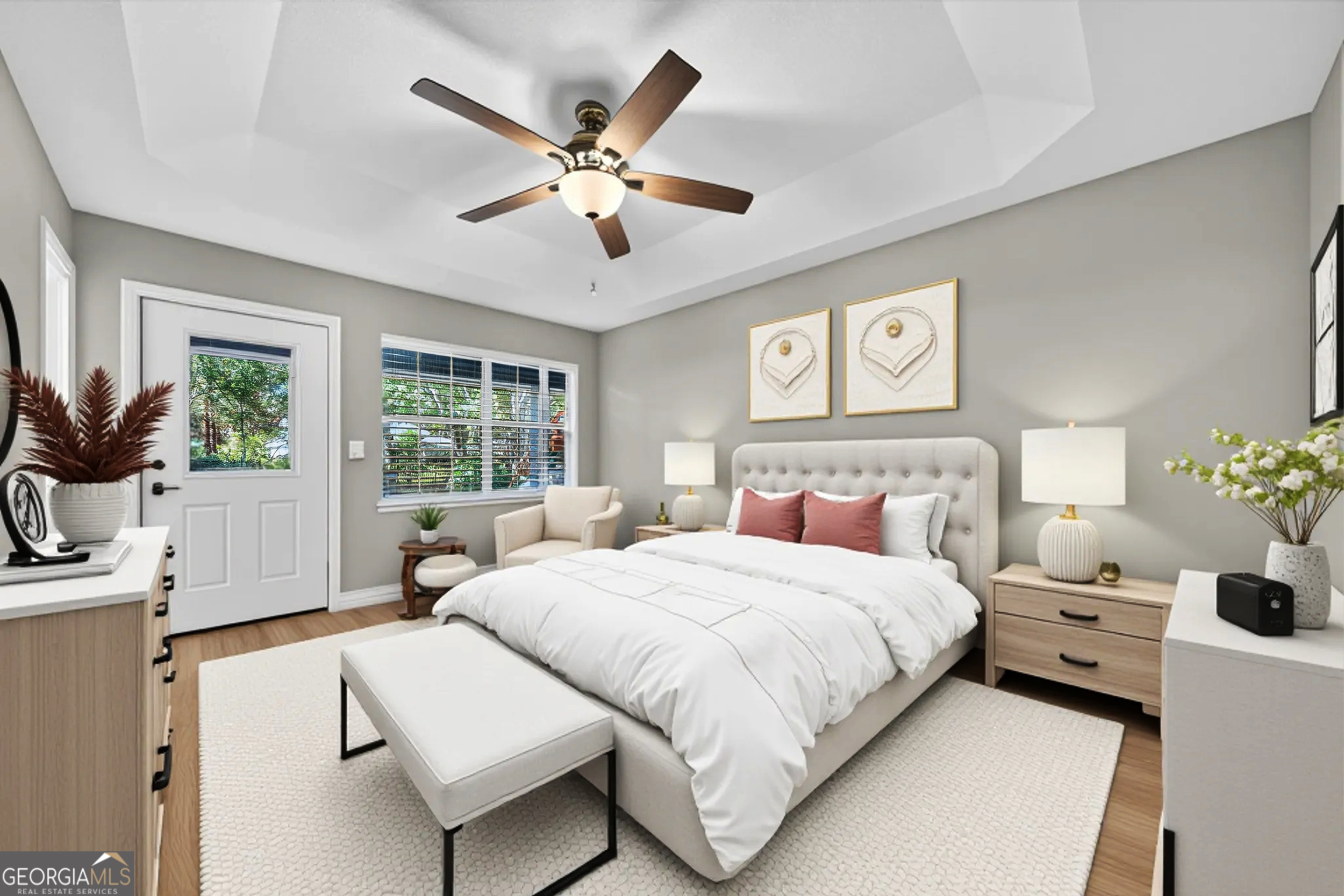 404 Morning Glory Road St. Marys, GA 31558 - Photo 20 of 34 a bedroom with a large bed and a chandelier