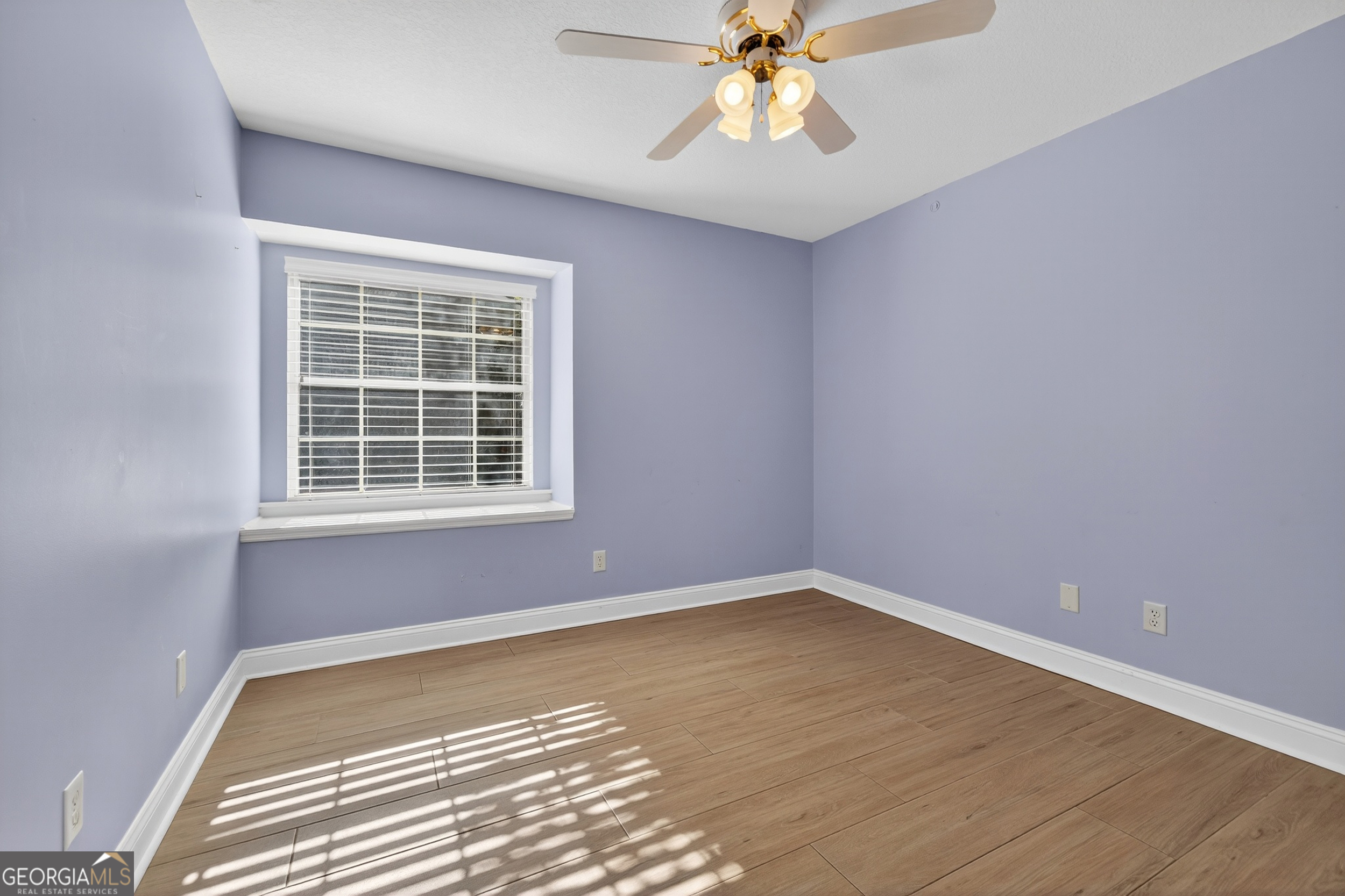 404 Morning Glory Road St. Marys, GA 31558 - Photo 23 of 34 a view of an empty room with a window and closet area