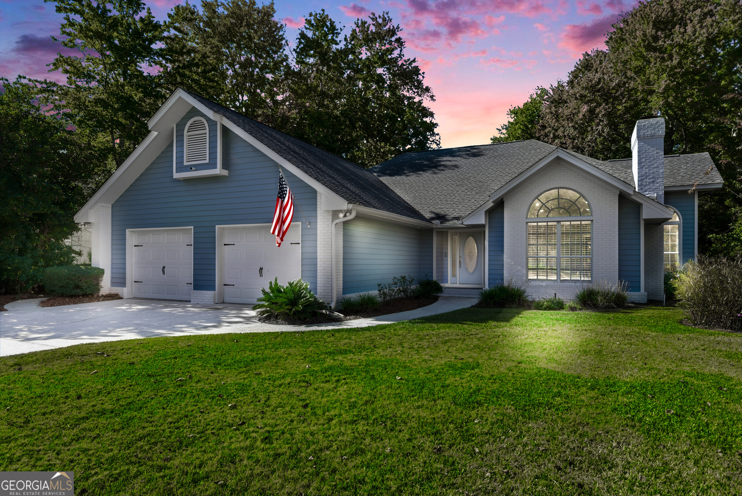 404 Morning Glory Road St. Marys, GA 31558 - Photo 33 of 34 a front view of a house with a yard and garage