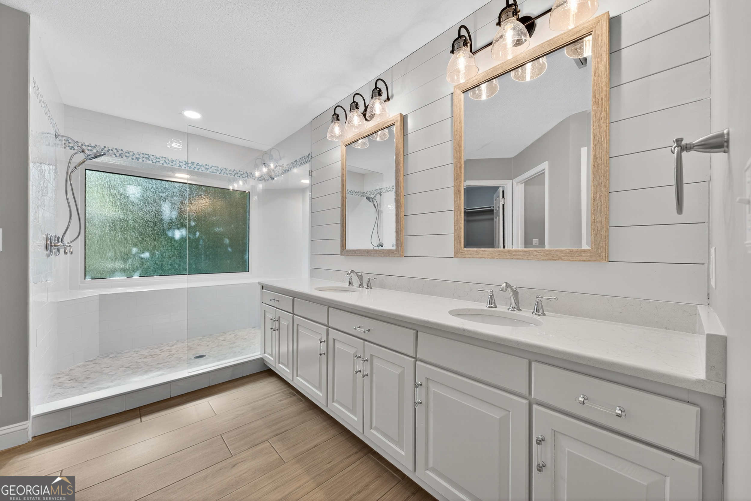 404 Morning Glory Road St. Marys, GA 31558 - Photo 5 of 34 a bathroom with a double vanity sink mirror and double