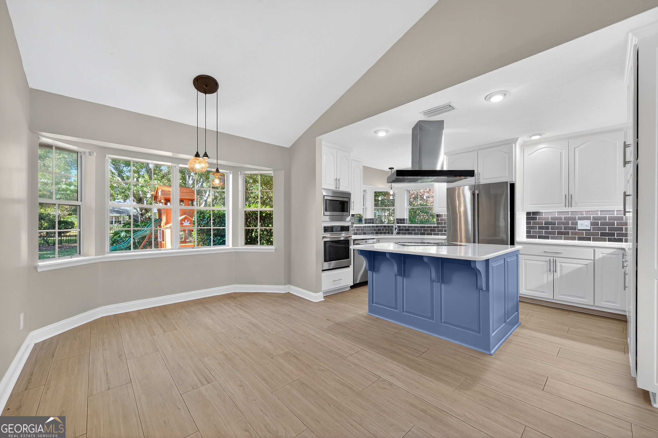 404 Morning Glory Road St. Marys, GA 31558 - Photo 9 of 34 a kitchen with stainless steel appliances granite countertop a stove and refrigerator