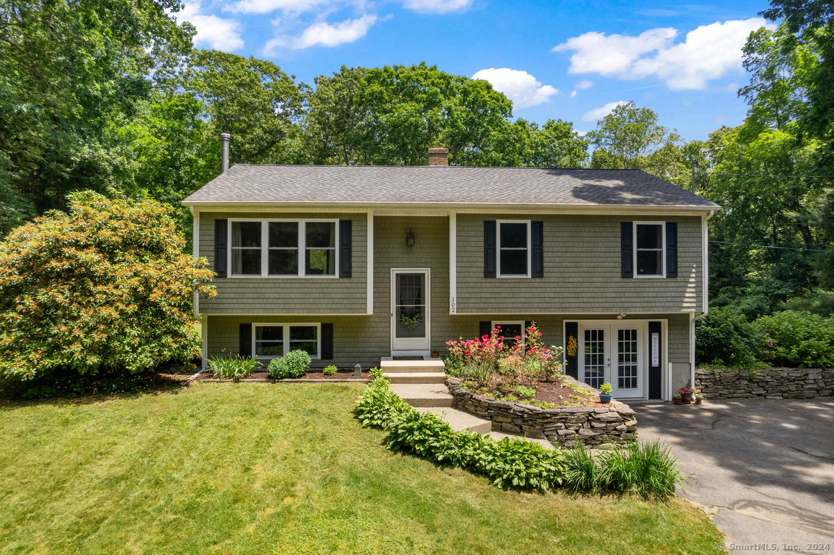 front view of a house with a yard