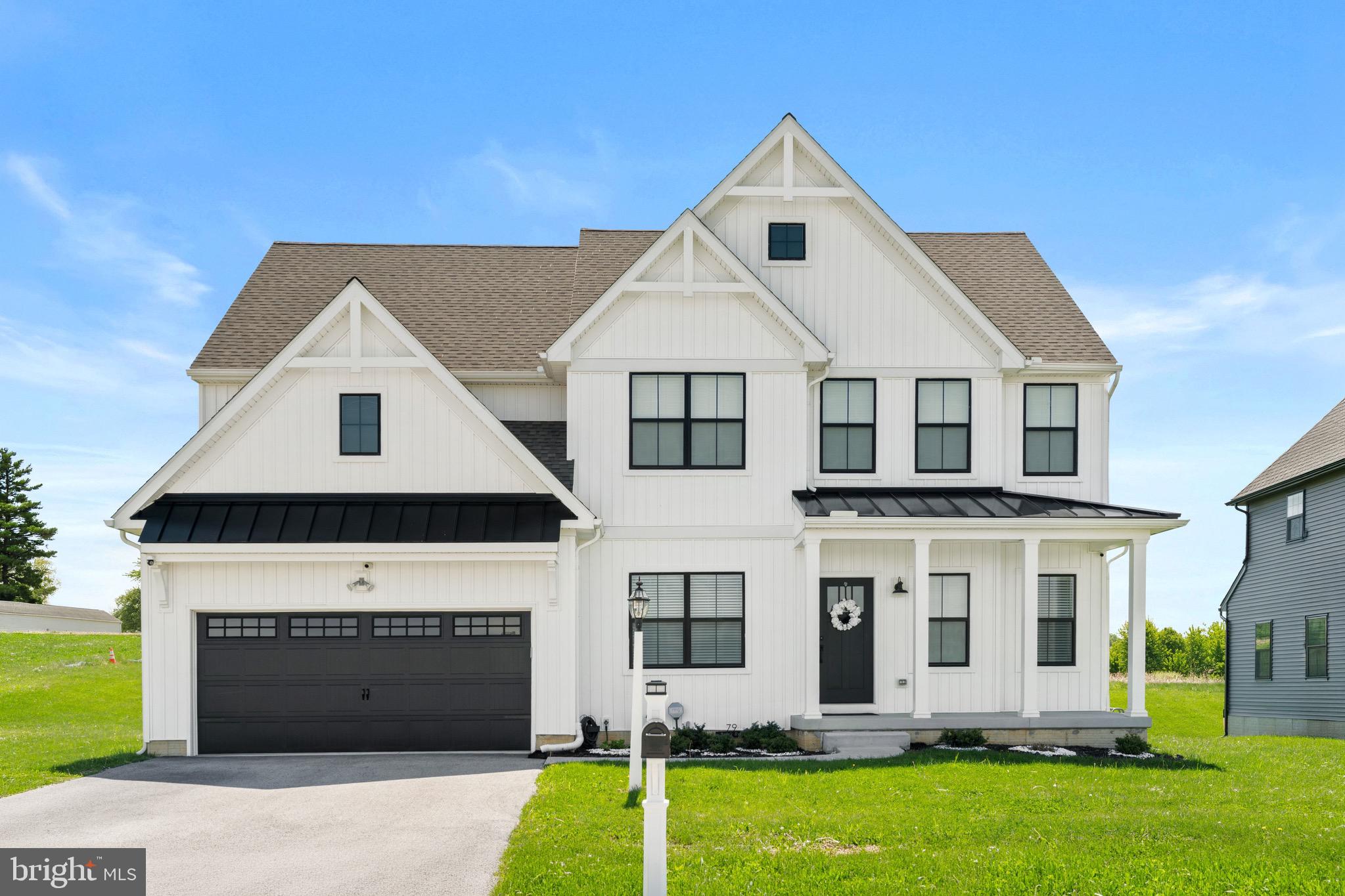 a front view of a house with yard