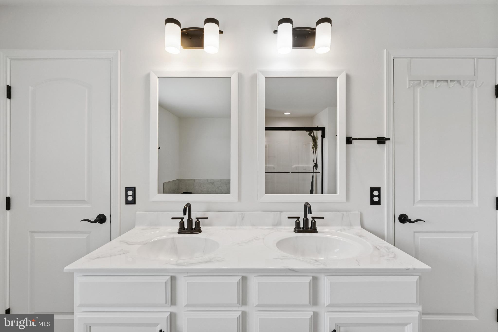 79 Beck Road York, PA 17403 - Photo 23 of 38 a bathroom with double vanity sinks and a mirror