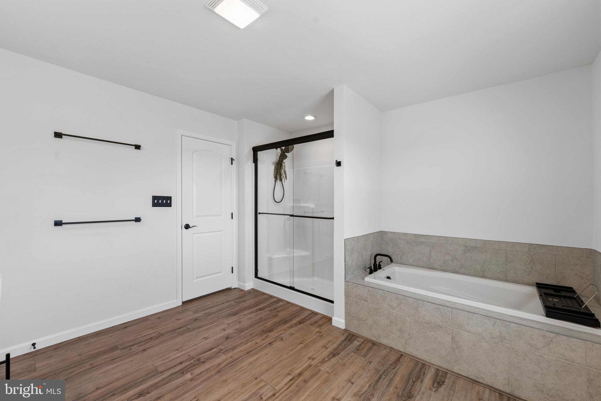 79 Beck Road York, PA 17403 - Photo 24 of 38 a bathroom with a bathtub and a shower