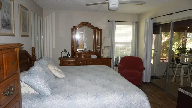 a bed room with furniture and a large window