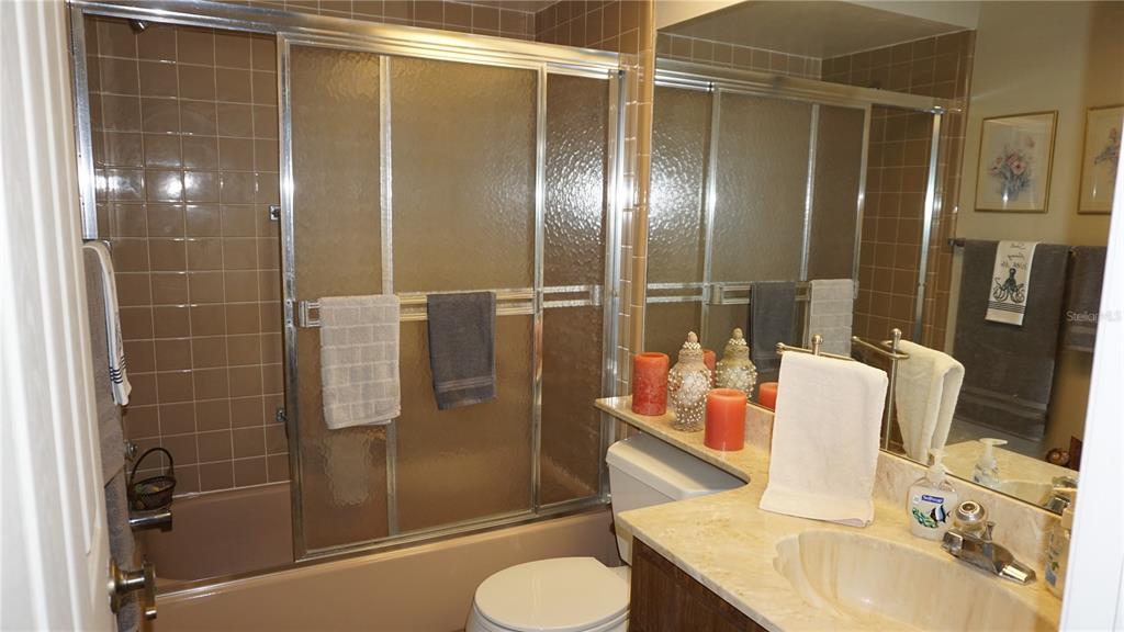 11241 Versailles Lane Port Richey, FL 34668 - Photo 20 of 38 a bathroom with a shower and a sink