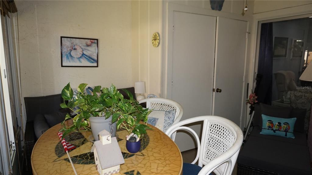 11241 Versailles Lane Port Richey, FL 34668 - Photo 22 of 38 a dining room with furniture and wooden floor