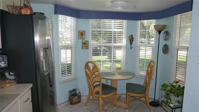 a dining room with furniture and window