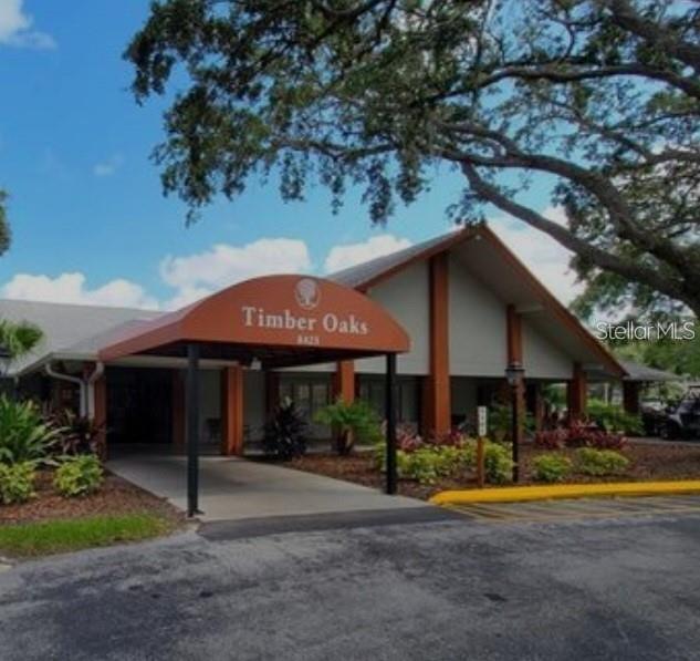 11241 Versailles Lane Port Richey, FL 34668 - Photo 31 of 38 a view of a house with swimming pool and a yard