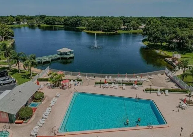 an aerial view of a house with a lake view