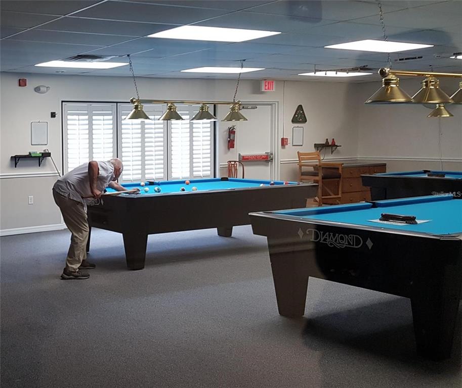 11241 Versailles Lane Port Richey, FL 34668 - Photo 37 of 38 a room with furniture and window