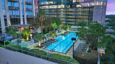 a view of a tall building from a patio