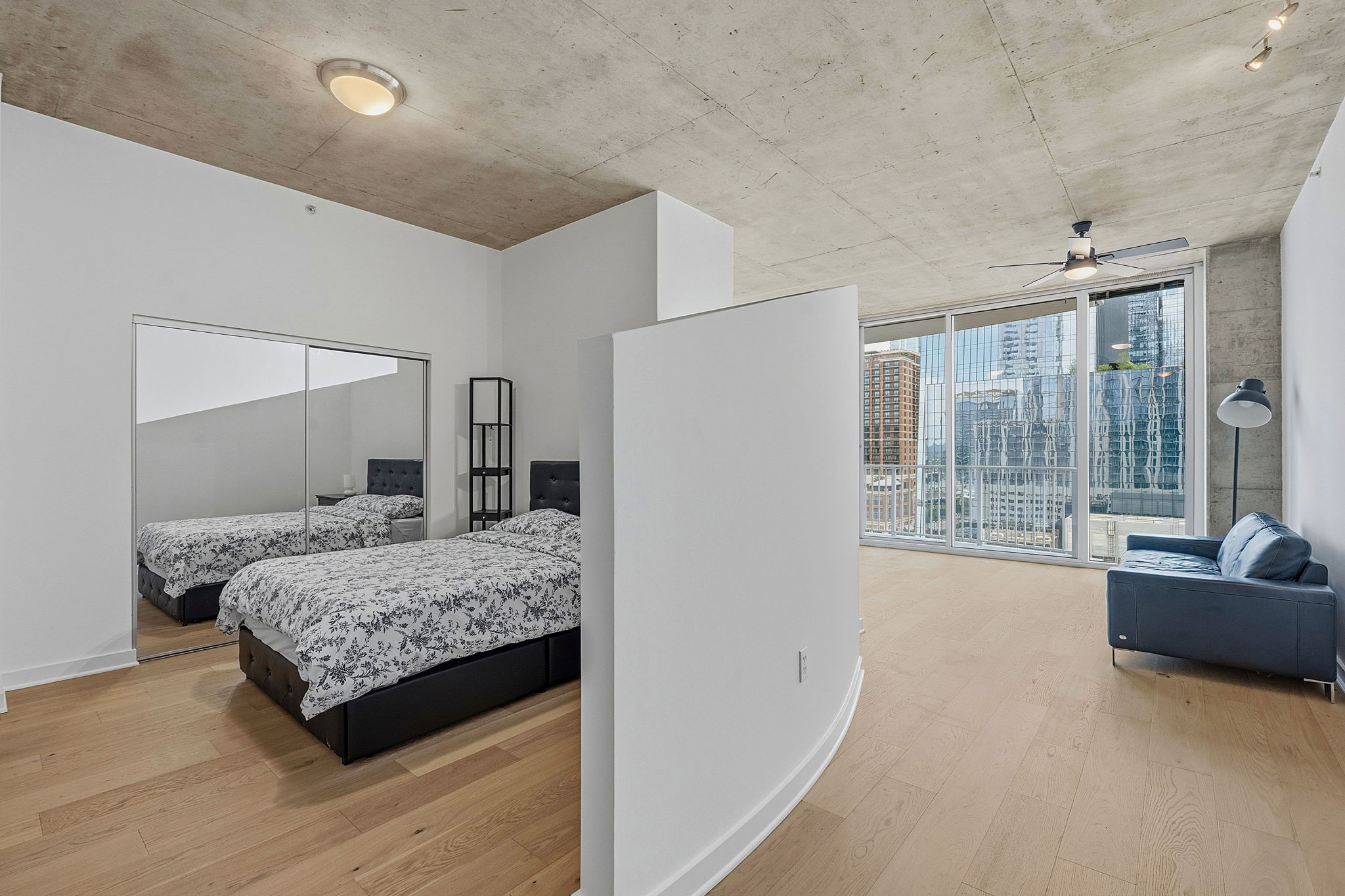 360 Nueces Street, Unit 1303 Austin, TX 78701 - Photo 11 of 40 a bedroom with a large bed and a large window