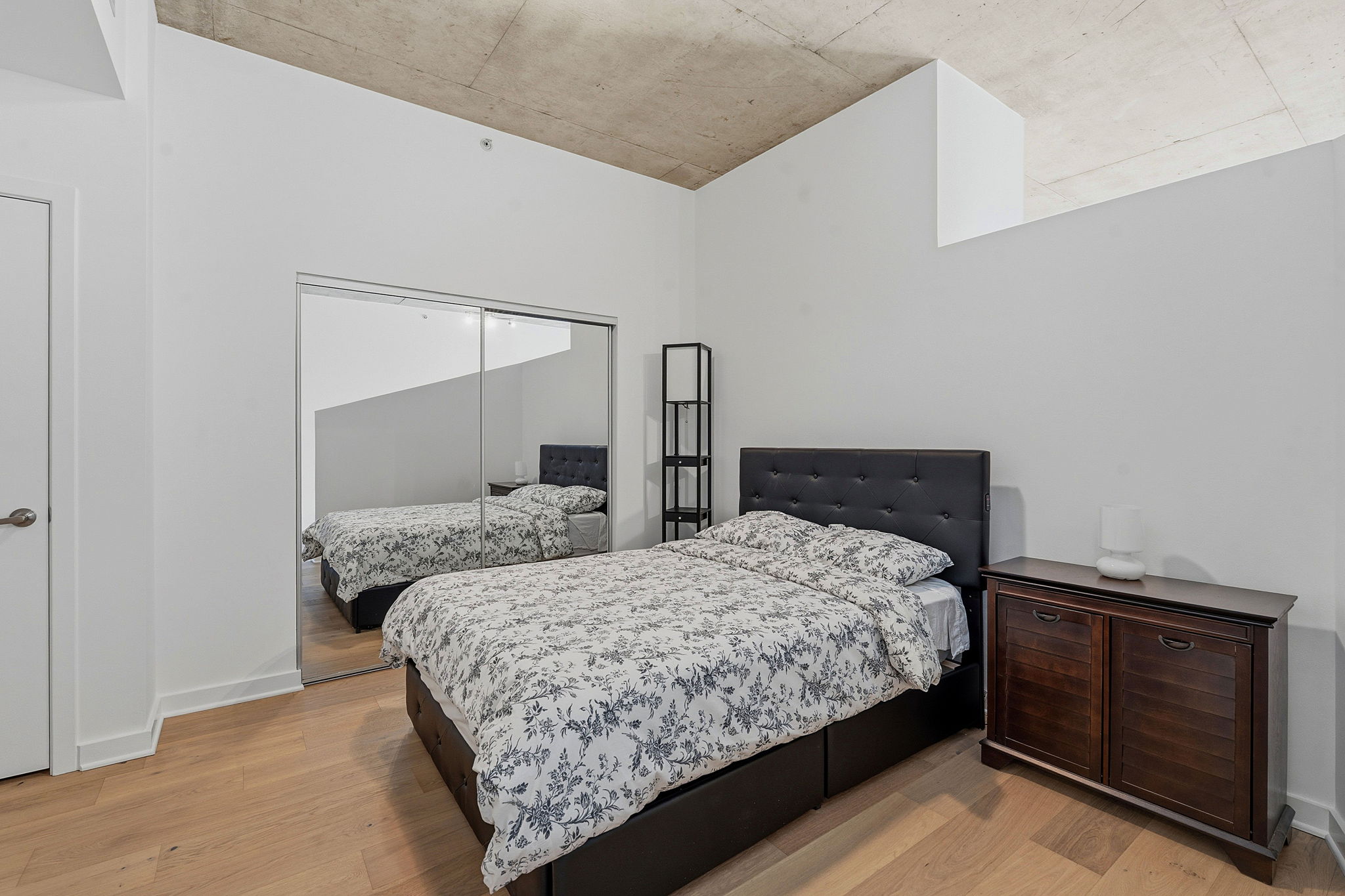 360 Nueces Street, Unit 1303 Austin, TX 78701 - Photo 13 of 40 a bedroom with a bed and two dresser
